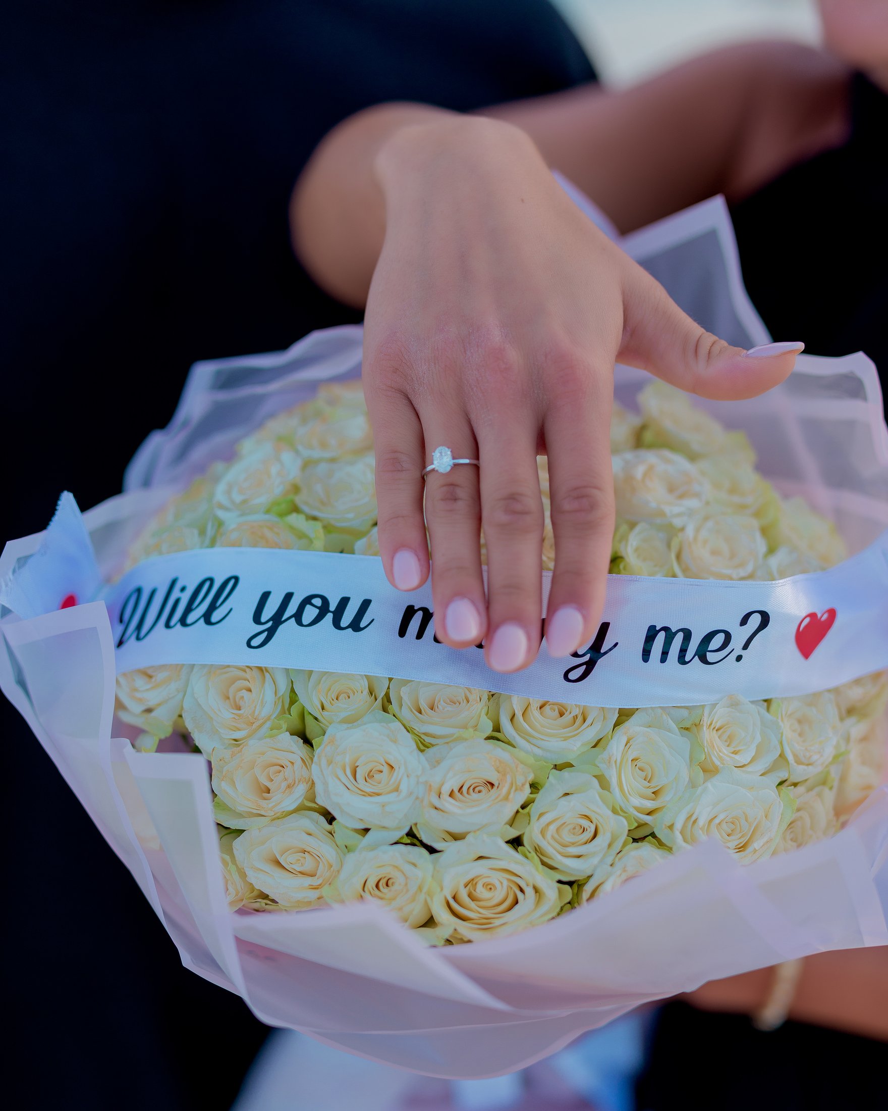 A proposal message nestled in flowers