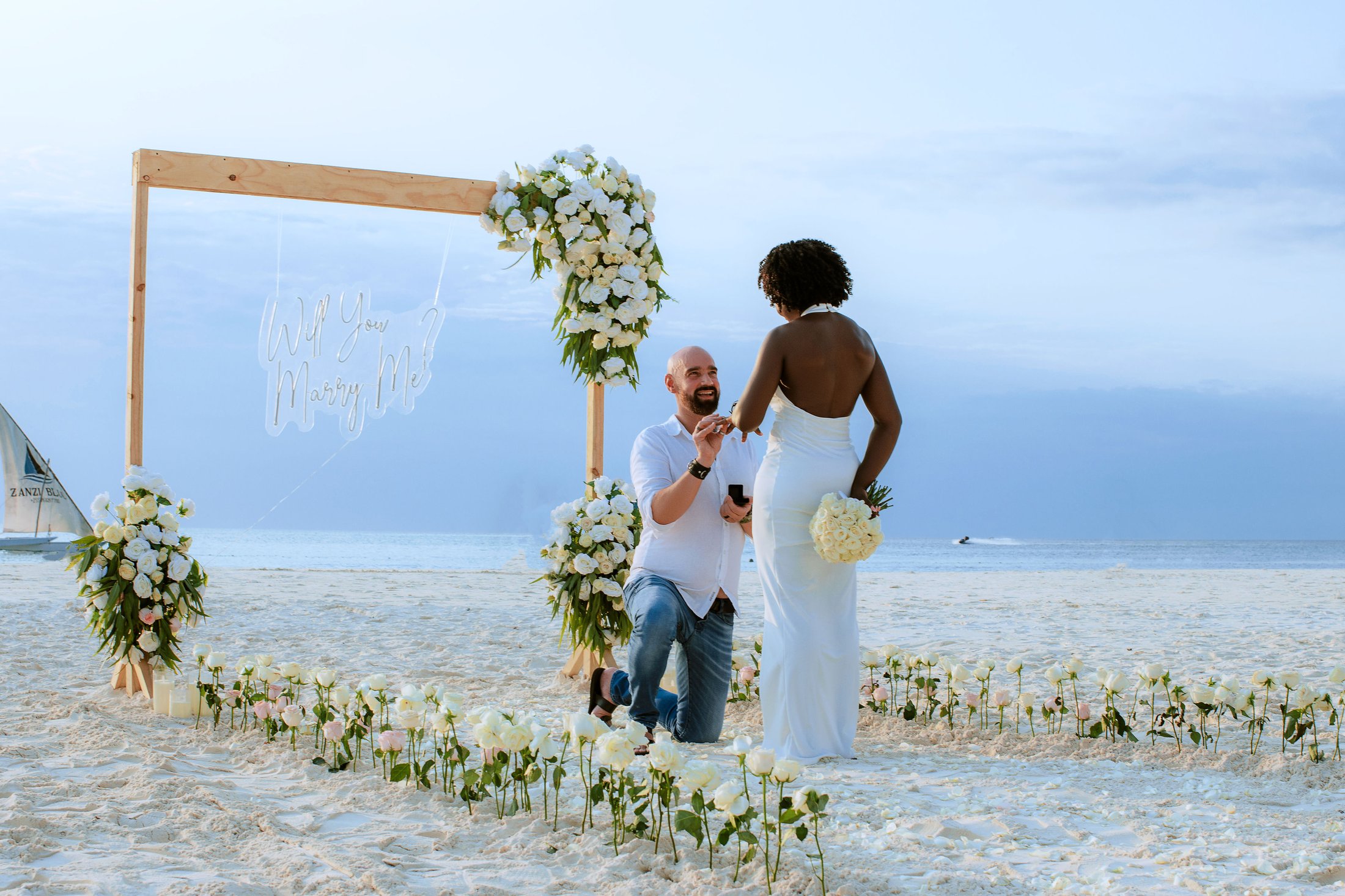 A romantic beach proposal designed by DS Lux Eventz